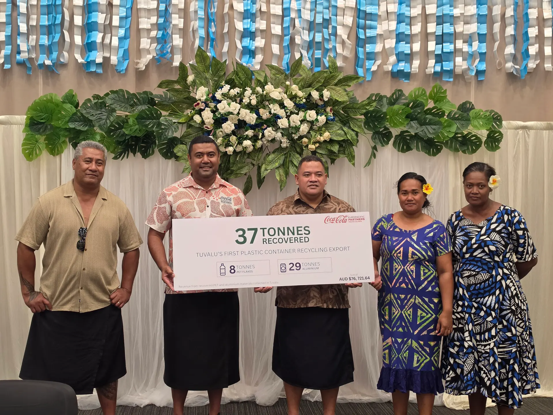  Coca-Cola Europacific Partners (CCEP) Pacific Islands' Dwain Qalovaki during the handover withTuvaluan Minister for Climate Change and Environment Dr. Maina Vakafua Talia.