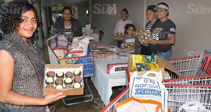 Na i Nuinui Trust members led by their president (right) Vasenai Lauta while collecting food ration for TC Harold affected people of Kadavu at Cost-U-Less corridor in Suva on April 28, 2020. Photo: Ronald Kumar