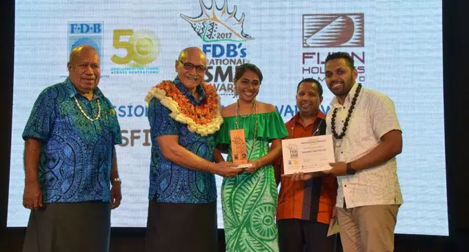 From left: President, Major-General (Ret’d) Jioji Konrote, Kids First owner Krystal Buksh  and her husband Ethan Buksh (far right) with Fijian Holdings Limited chief executive officer Nouzab Fareed at the 2017 FDB National SME Awards night .  Photo: Fiji Development Bank.