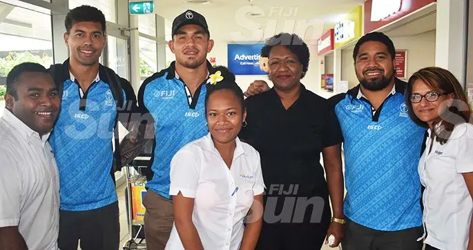 Fiji Airways Flying Fijians Ben Volavola, Jale Vatubua and Campese Maafu with fans at the Nadi International Airport on October 15, 2019. Photo: WAISEA NASOKIA
