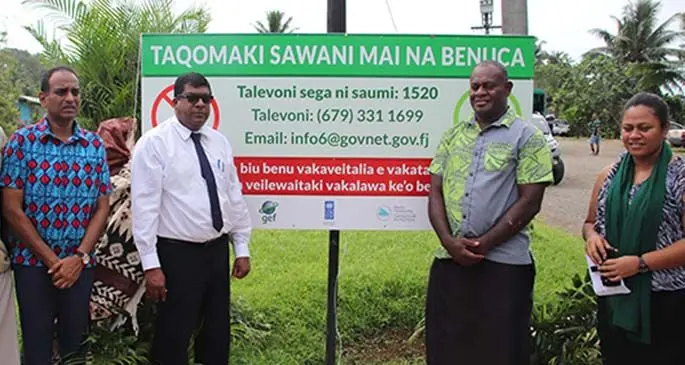 Permanent Secretary Joshua Wycliffe (left), and Minister for Environment Mahendra Reddy (second from left) with staff of Ministry of Environment and villagers in Sawani, Naitasiri. Photo: Ministry of Environment and Waterways