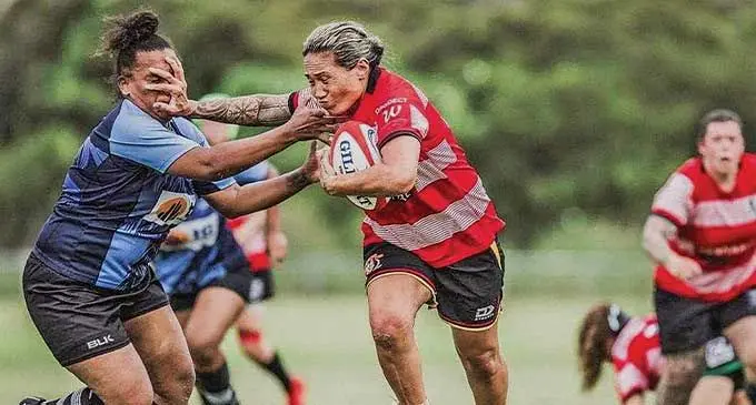 Tuiai Elisara (with ball) of the Australia/NZ combine team fends off Fiji’s Melita Cook during the Australian Deaf Games on January 15, 2024. Fiji women’s won gold. Photo: Deaf Sports NZ