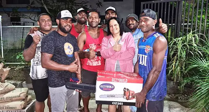 The Honourable Minister of Education, Rosy Akbar and the K9E brothers after a trade