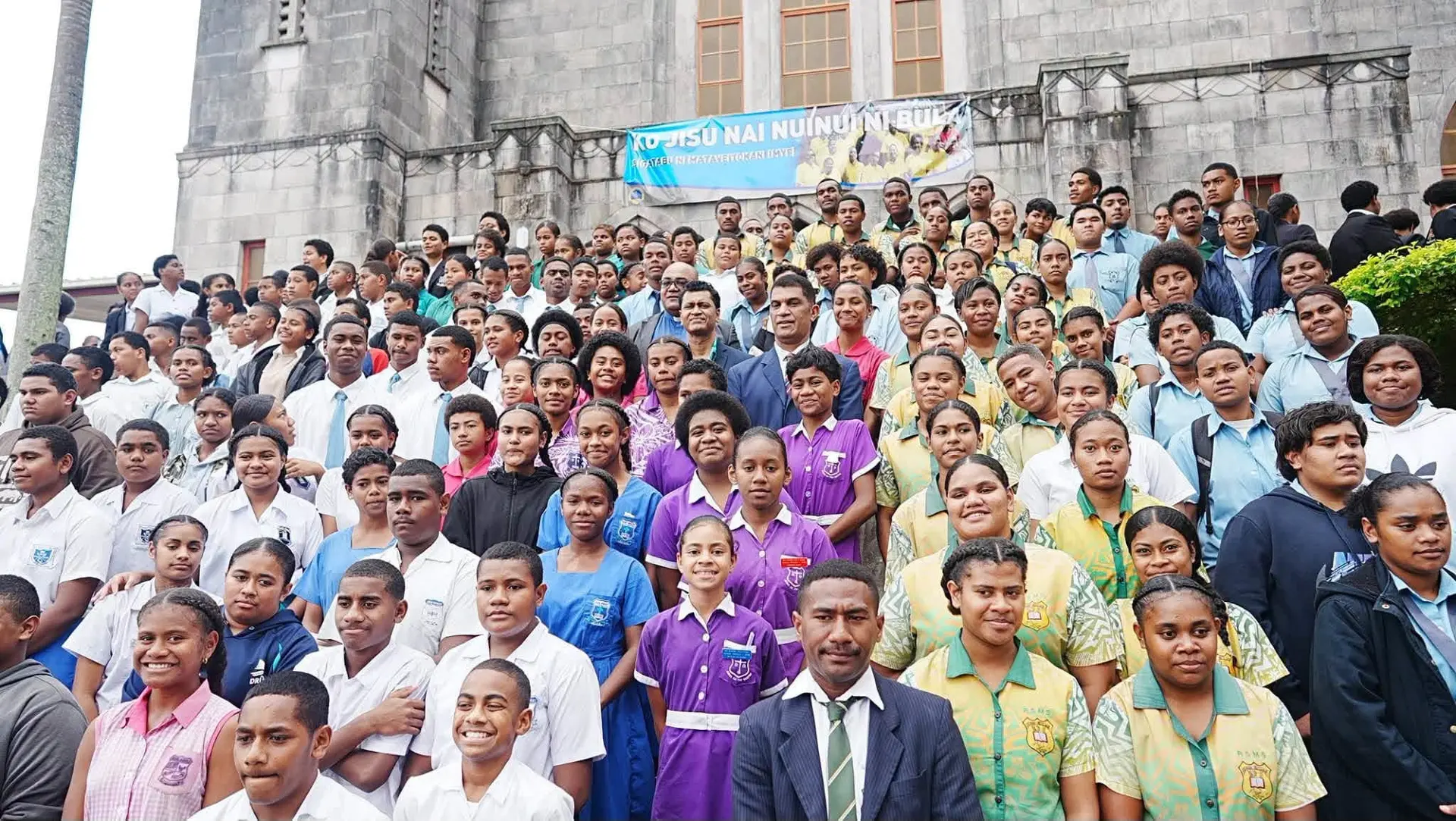Education Minister Aseri Radrodro with students from Suva schools.