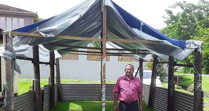 Shiloh Tabernacle Christian Fellowship Church pastor Kamla Prasad outside the temporary shed at Naiyaca subdivision on March 7, 2021, that was set up after the fire in January this year.