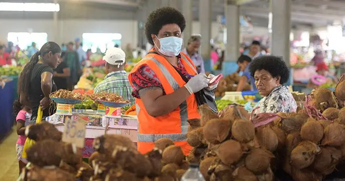 Nausori Market attendant, Kinisiana Livia stays safe by using a face mask. Photo: Ronald Kumar