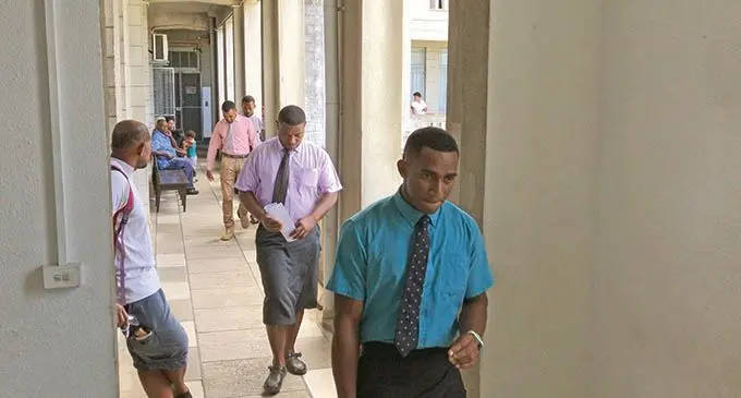 Sevanaia Narogi (blue shirt) outside the High Court in Suva on November 17, 2020.