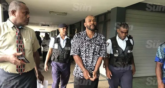Veresa Vatia is escorted by Police outside the Magistrate Court in Labasa on April 20, 2020. Photo: Laisa Lui