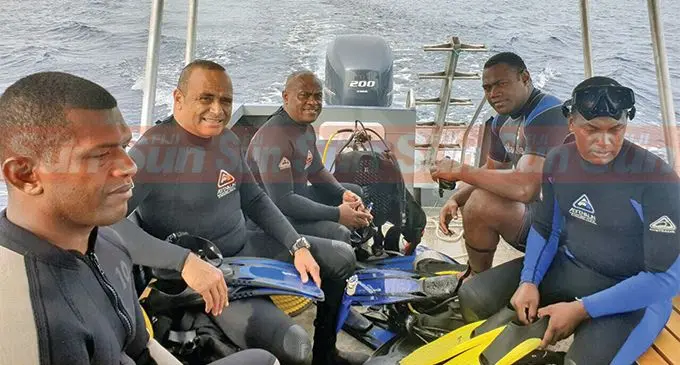 Police Commissioner Brigadier-General Sitiveni Qiliho (second from left) with officers during their search for the underwater transponder recently. Photo: Fiji Police Media Cell