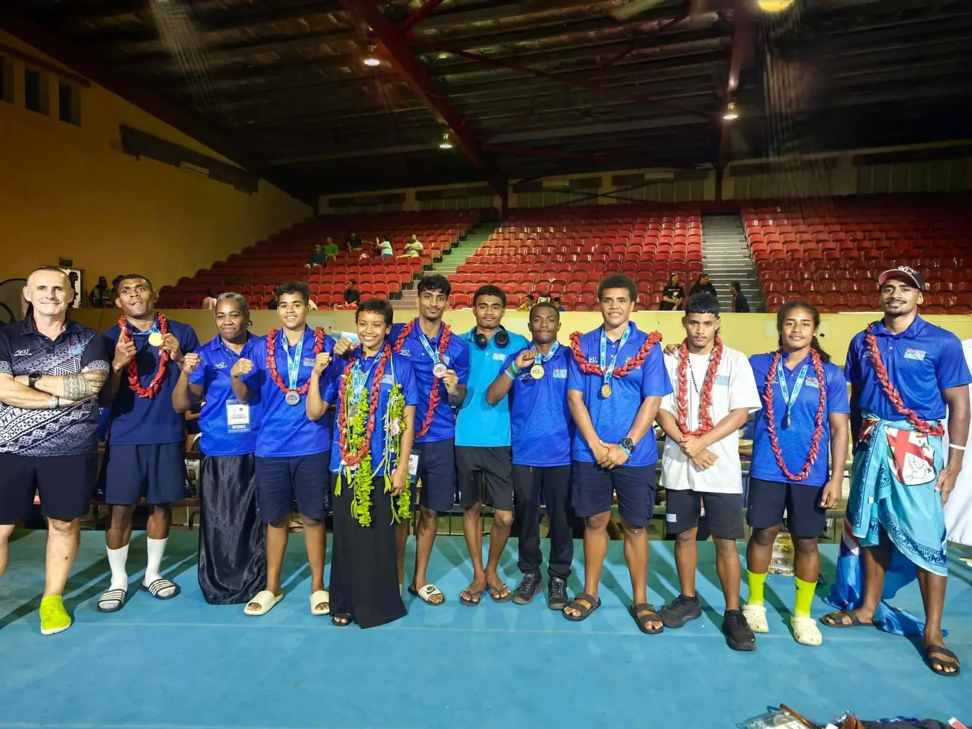 Fiji amateur boxers to the upcoming Youth Olympic Games, Norman Amram (10th from left) and Merewalesi Kolitapa during the Oceania invitational event in Apia, Samoa. 
