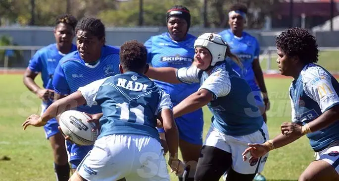 Yasawa Marlins Women’s forward Sereima Rauqe (with ball) breaks away from Nadi prop Lailanie Burnes during their Skipper Cup clash at Churchill Park, Lautoka on July 25, 2020. Photo: Waisea Nasokia.