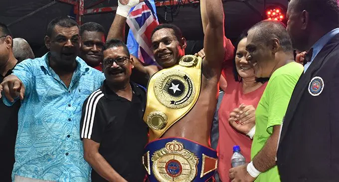 Fijian light heavyweight champion Savenaca Nalica’s hand is being lifted by the Minister for Education, Heritage and Arts Rosy Akbar (right) while trainer Farmaan Ali looks on after the second round knockout win over John Korake at AD Patel College ground in Ba on February 29, 2020. Photo: Waisea Nasokia 