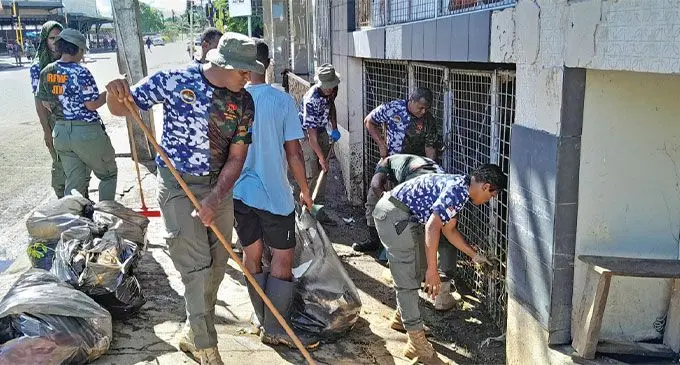 Republic of Fiji Military Forces (RFMF) officers assist Nadi Town Council in cleaning Nadi Town after the flooding over the weekend.  Photos: Waisea Nasokia