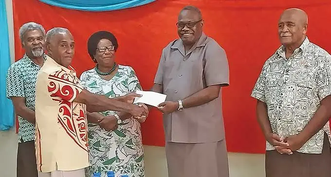 Tailevu Dairy Farmers Cooperative Association Limited chairman, Rusiate Korovusere receives a cheque from the director of Tailevu Holdings Company Pte Limited, Ratu Emosi Tuinakelo