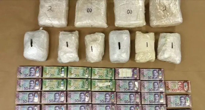Drugs and cash seized by Police.