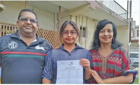 Fiji Year 13 Certificate Examination (FY13CE) Labasa College highest mark scorer, Tanisha Kumar, with dad Ajendra Kumar, and mom Raksh in Labasa, on January 11, 2024. Photo: Sampras Anand