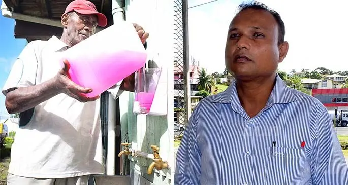 (From left-right): Suva Primary School caretaker Neurua Vatemo fillup hand sanitizer next to the school taps as primary schools around the country prepares to open from next week and Suva Primary School head teacher, Brij Singh at School on June 29, 2020. Photo: Ronald Kumar