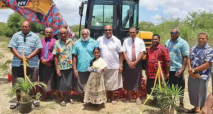 Deputy Prime Minister and Minister for Trade, Co-operatives, Micro, Small and Medium Enterprises and Communications, Manoa Kamikamica with resource owners of Malolo during the handover of an excavator to Tokatoka Namara Development.