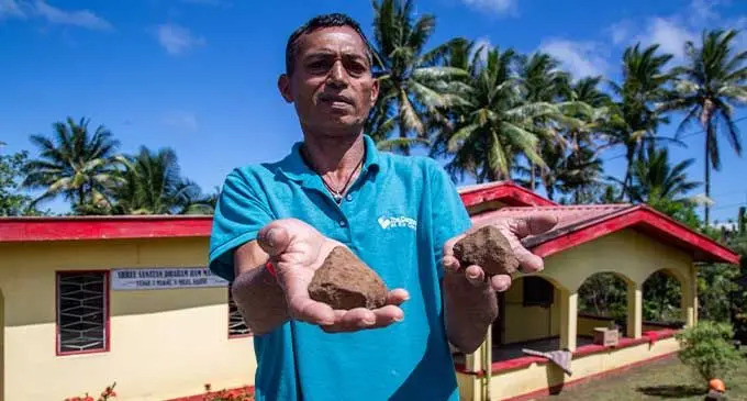 Devend Lal shows the stones that were allegedly thrown at him while cleaning the Shree Sanatan Dharam Ram Mandir in Makoi on September 25, 2022. Photo: Leon Lord