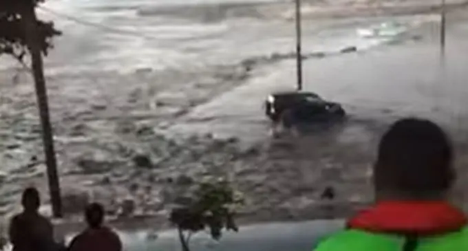 A vehicle is swept away after tsunami waves hit Tonga after the volcano eruption on Saturday 15 January, 2022.