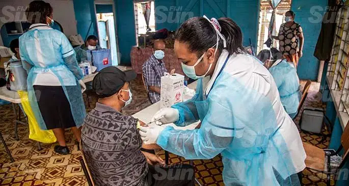 Staff nurse Asinate Gadekilodoni administers an AstraZeneca jab during the vaccination drive in Cunningham on May 24, 2021. Photo: Leon Lord