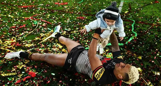 Two-time Premiership winner Viliame Kikau celebrates the National Rugby League (NRL) grandfinal win over the Parramatta Eels with his baby son in Sydney, Australia, on October 2, 2022. Kikau is co-captain of the Fijian Bati in the Rugby League World Cup , which starts on October 15. Photo: NRL.com