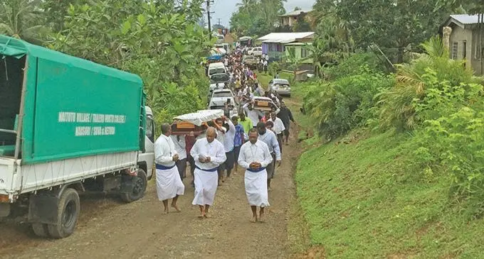 Navunisole villagers in Tailevu lead the funeral procession for Lodoviko Canakaivata, Elia Canakaivata and Kelemete Raivuni at their village on January 2, 2021. They died in a head-on collision on December 27.  Photos: Inoke Rabonu.