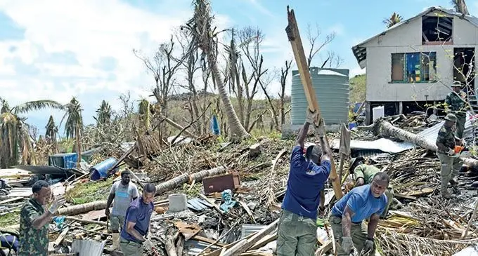 Military personnel clearing up debri on Kia Island. Photo: Laisa Lui
