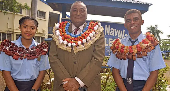 From left: Ratu Navula College head girl Siteri Saukuru, school manager Apimeleki Lalabalavu and head boy Apimeleki Kadavu after the induction at the school on May 20, 2022. Photo: Mereleki Nai