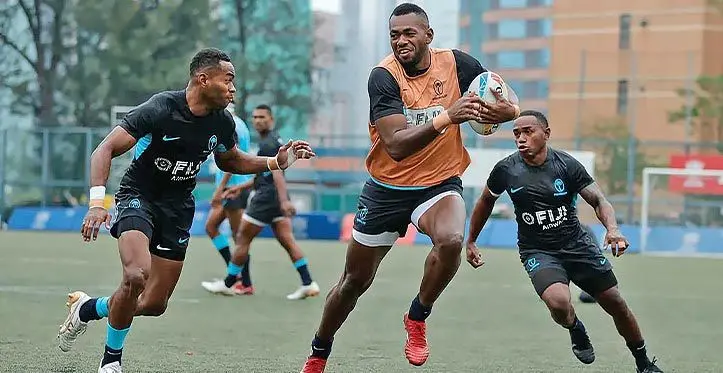 Sevuloni Mocenagi (with ball) on attack during the team's training session in Hong Kong on March 29, 2023. Photo: World Rugby