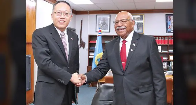 People’s Republic of China’s chargé d’affaires and Political Counsellor, Wang Xuguang with Prime Minister Sitiveni Rabuka. Photo: DEPTFO News
