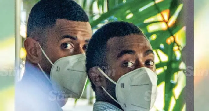 Fiji Corrections Service personnel Iferemi Ravoka (left), and Timoci Tupou outside the Magistrates Court in Suva on May 17, 2021. Photo: Leon Lord