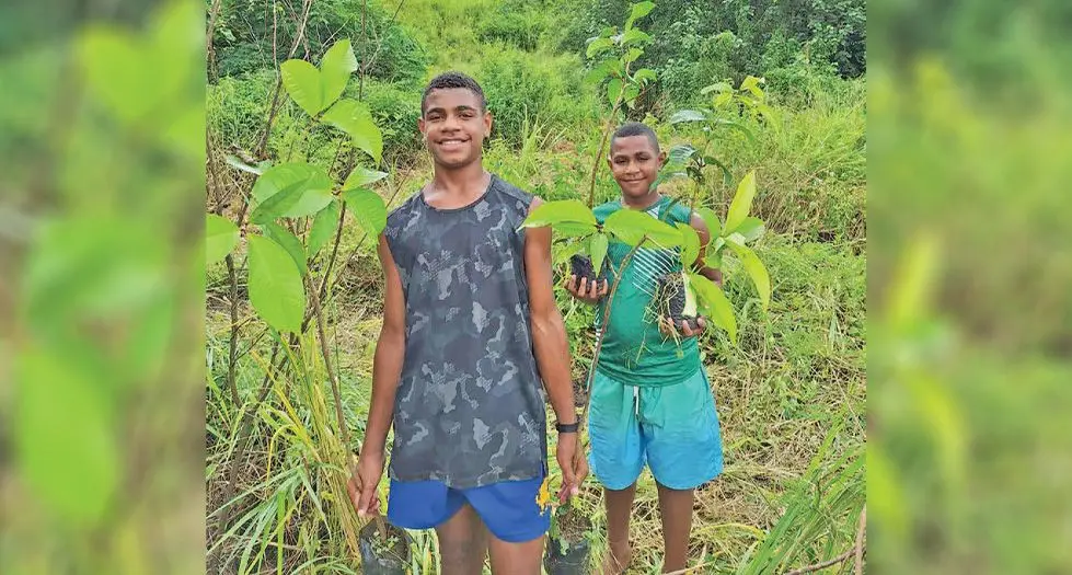 Kids participating in the tree planting. Photo credit: Sigatoka Sand Dunes.