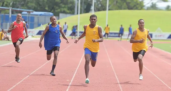 Suva Grammar School’s Semesa Daginivalu (third from left) wins the senior boy’s 100m heat during their inter-house competition at the HFC Bank Stadium in Suva, today. Photo: Ronald Kumar