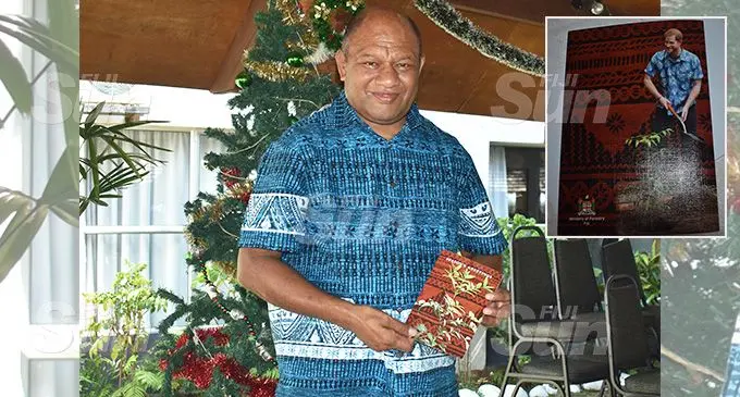 Minister, Osea Naiqamu after signing the royal Christmas card at the Capricorn International Hotel in Nadi. Photo: Mereleki Nai