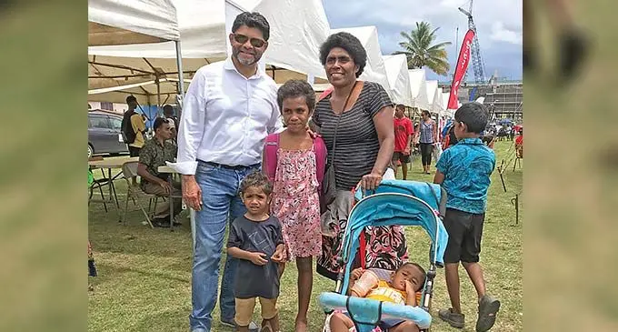 Attorney-General and Minister for Communications Aiyaz Sayed-Khaiyum with Maraia Batinikula and her children at Walesi carnival in Labasa on November 26, 2022. Photo: Shratika Naidu