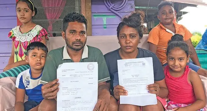 Ronald Ravi Chand holding his court documents and medical notice with wife, Preetika Deo and their children (from left) Shaanvi Chand, Ronav Chand, Shanav Chand and Suhanvi Chand at their home in Vunivau, Labasa on January 23, 2022. Photo: Laisa Lui