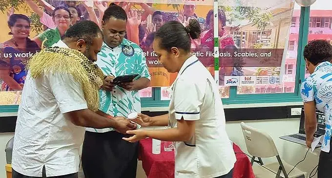 (Left) Minister for Health and Medical Services, Dr Ifereimi Waqainabete, is administrated with the Lymphatic Filariasis tablets during the launch of its Mass Drug Administration programme for the disease in Labasa on September 28, 2022.Photo: Sampras Anand.