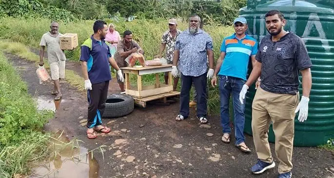 Donors on the right handed out food pack assistance to residents at the Dreketi lockdown area in Macuata on May 5, 2020.
