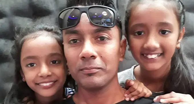 In happier days.... Salvin Singh with his two daughters Sana and Samarah.