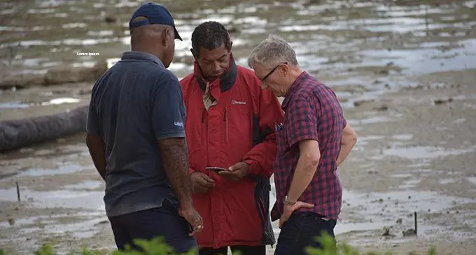 Crash investigator Andrew McGreggor (right), discussing possible flight pathways with rescue personnel on August 5, 2019.  Photo: Shalveen Chand