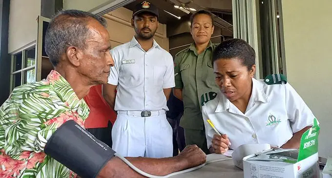 Vinod Lal (left) gets free medical check from the Indian Naval Ship INS Satpura crew member, Abhiraj Rajebra, LCPL Rakarosa Nainai (RFMF) and Staff Nurse Vosatata Talei during the free medical screening at the Albert Park Pavilion foyer on September 2, 2022. Photo: Ronald Kumar