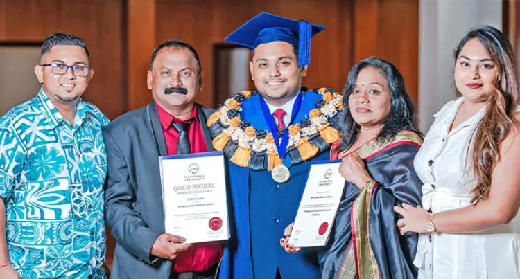 A photograph of Monishkar Naidu with family holding two certificates.   