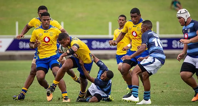 Lelean Memorial School Under-18 first five eight Penijamini Saurara  (with ball) is tackled by Suva Grammar School winger Isaac Rabaka while Filipe Baselala closes in during the Vodafone Deans Trophy national quarterfinals at the HFC Bank Stadium, Suva, on September 24, 2022. Photo: Leon Lord