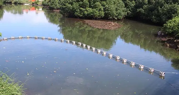 Fiji’s first floating trash net installed close to Bailey Bridge, Samabula River in Suva. Photo: Ministry of Environment