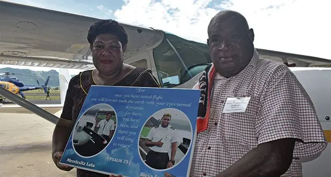 Iliesa Tawalo’s motherJoana Bainivalu, left, and uncle Mosese Baleidrokadroka holding a memorial picture. Photo: Nicolette Chambers