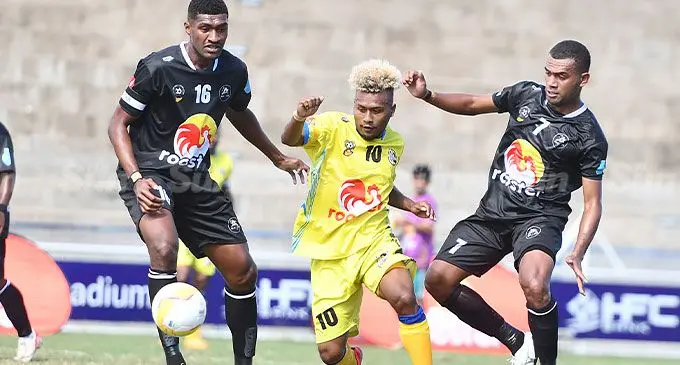 Ba’s Etonia Dogalau (16) and Ilaisa Vulimainavuso (7) defend against Nadroga’s striker Steward Toata in their Group A clash at the Battle of the Giants tournament at the HFC Bank Stadium, Suva, on July 26, 2024. Photo: Ronald Kumar.   