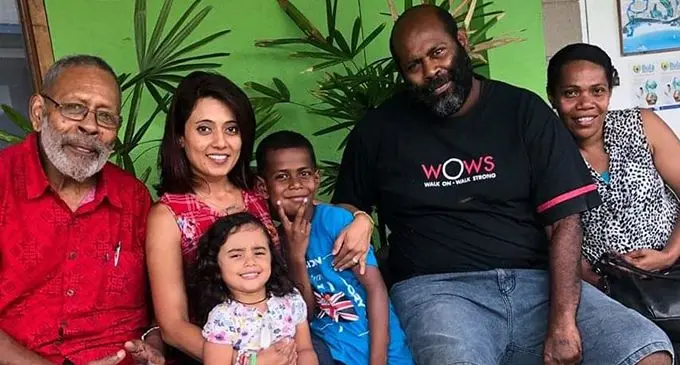 Kalivati Volavola (fourth from left) with parents (fifth and sixth from left) who are stranded in India.  