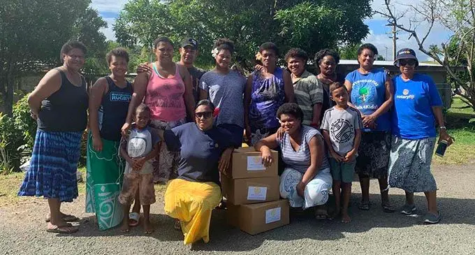 The Rotary Club of Lautoka (District 9920) Youth Ambassador and Projects, Melissa Natawake ( second from left, frontrow) with members of the club during their  distribution to the different families at Malevu and Korotogo Village in Sigatoka.  