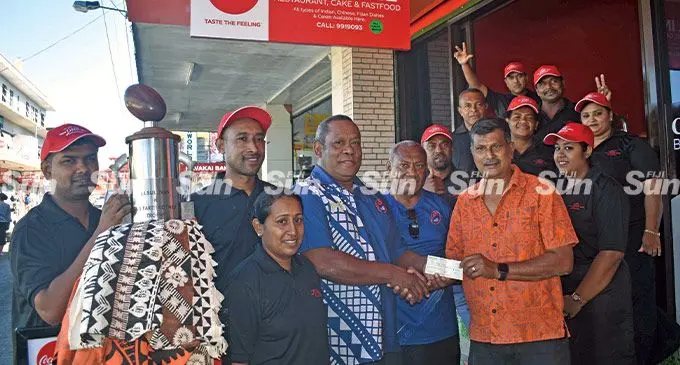 Nadi Rugby Union president Mataiasi Nabou receives the cheque from All In One Restaurant Cake and Fastfood general manager Navneeda Goundar in Nadi on June 7, 2022. Photo: Waisea Nasokia
